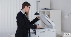 professional woman using a copier she leased from BDL Copiers